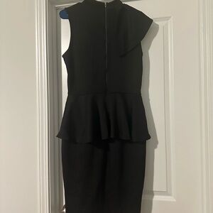 Black peplum sleeveless dress.